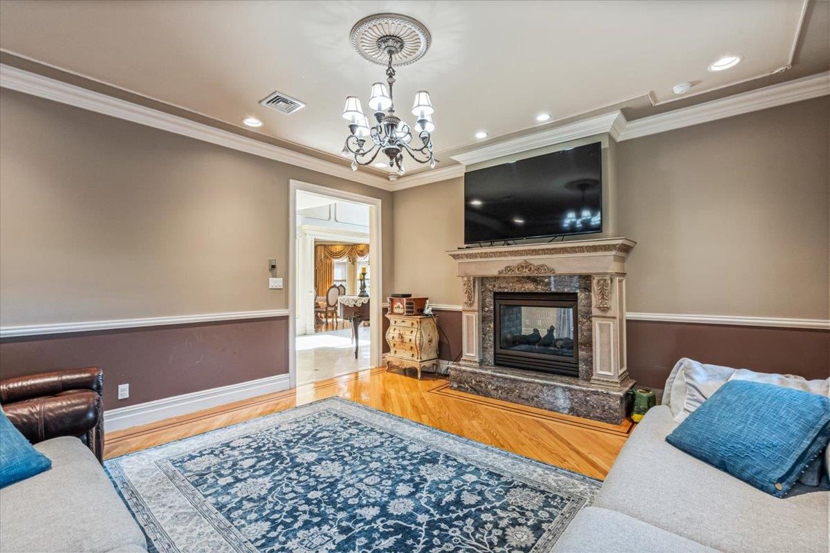 Chandelier, Fireplace, Interior, Living room, Recessed Lighting, Wood Texture Flooring