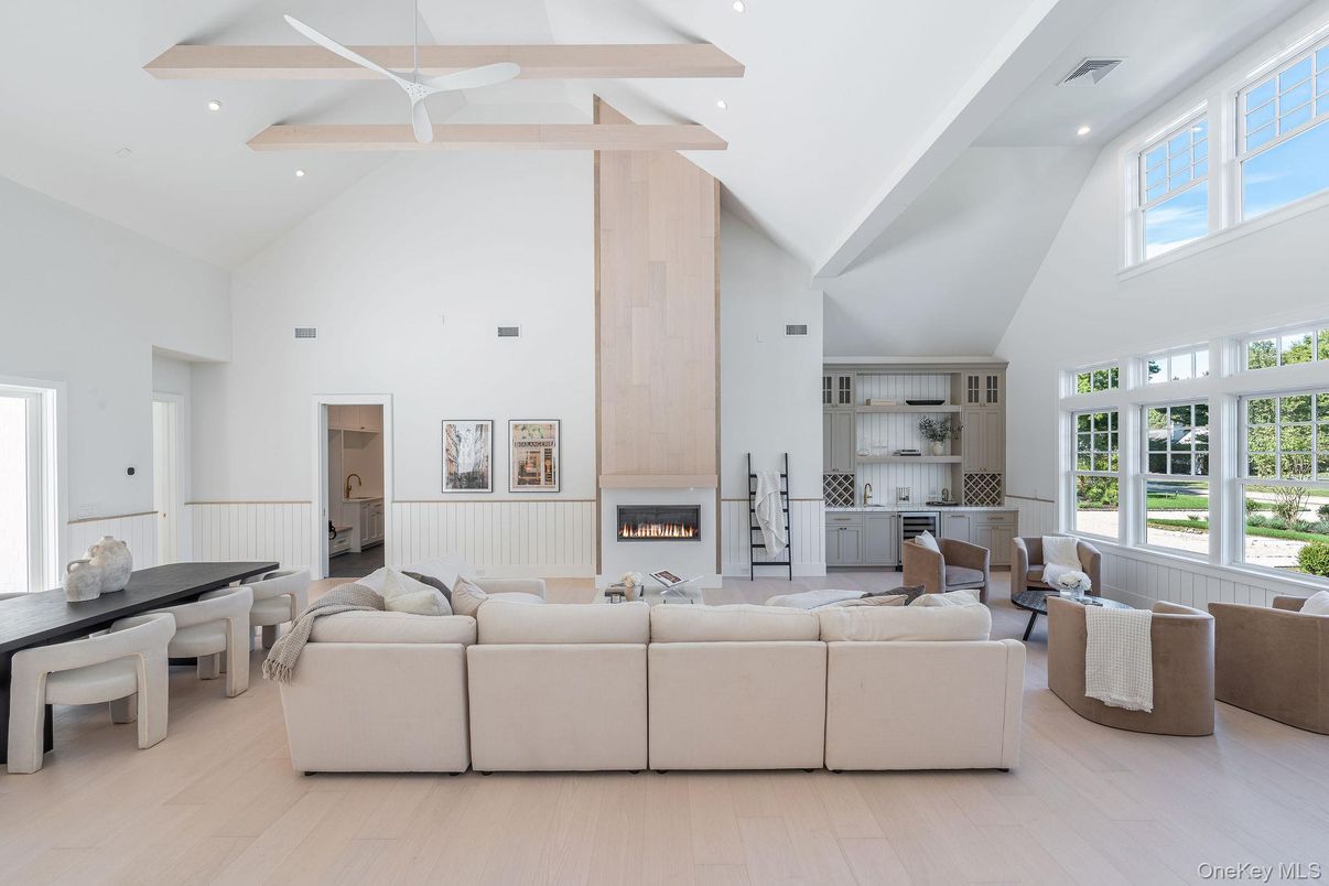 Dining room, Fireplace, Interior, Living room, Recessed Lighting, Wood Texture Flooring