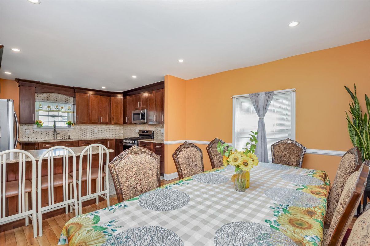 Dining room, Interior, Kitchen, Recessed Lighting, Stainless Steel Appliances, Wood Texture Flooring