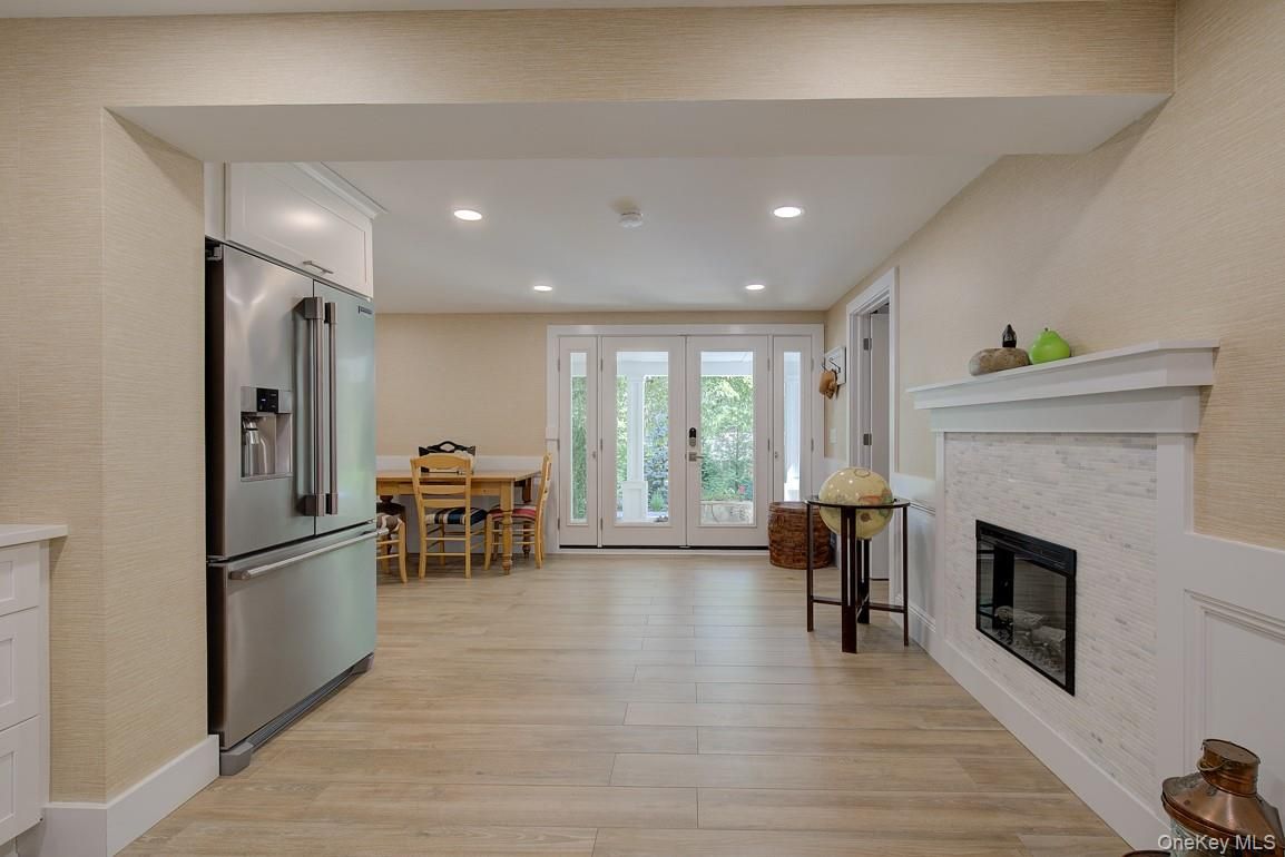 Dining room, Fireplace, Interior, Kitchen, Recessed Lighting, Wood Texture Flooring