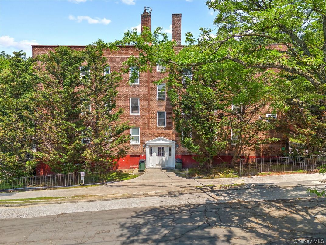 Exterior, Facade, Brick Facade, Condo Building