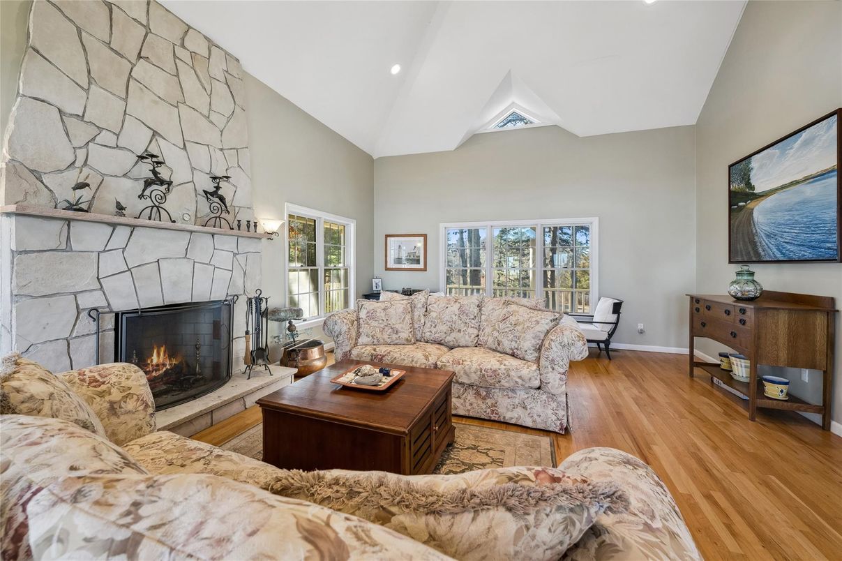 Fireplace, Interior, Living room, Recessed Lighting, Stone Walls, Wood Texture Flooring