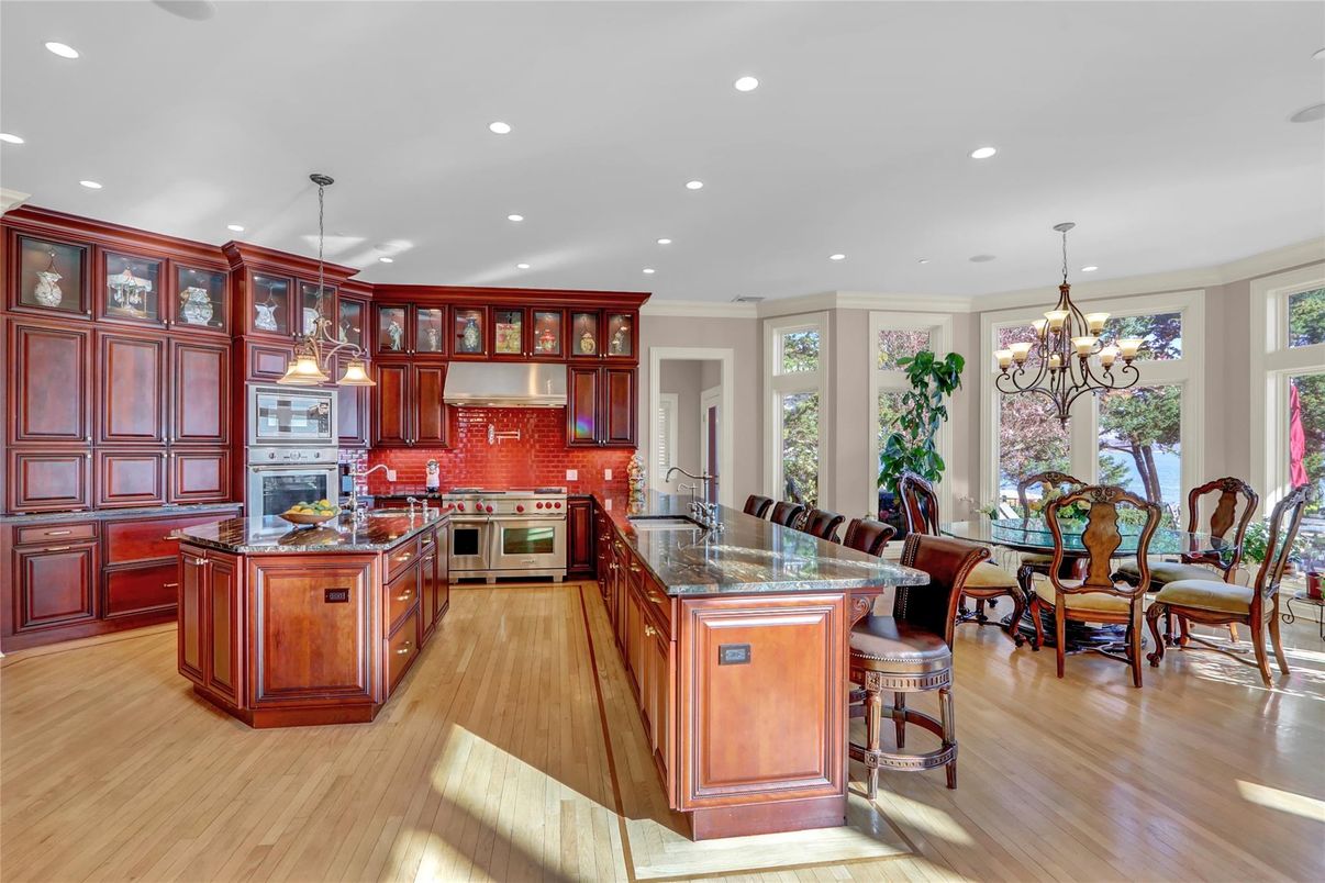 Chandelier, Dining room, Interior, Kitchen, Pendant Lights, Recessed Lighting, Stainless Steel Appliances, Wood Texture Flooring