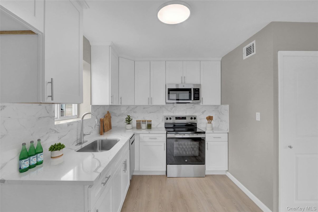 Interior, Kitchen, Marble Walls, Stainless Steel Appliances, Wood Texture Flooring