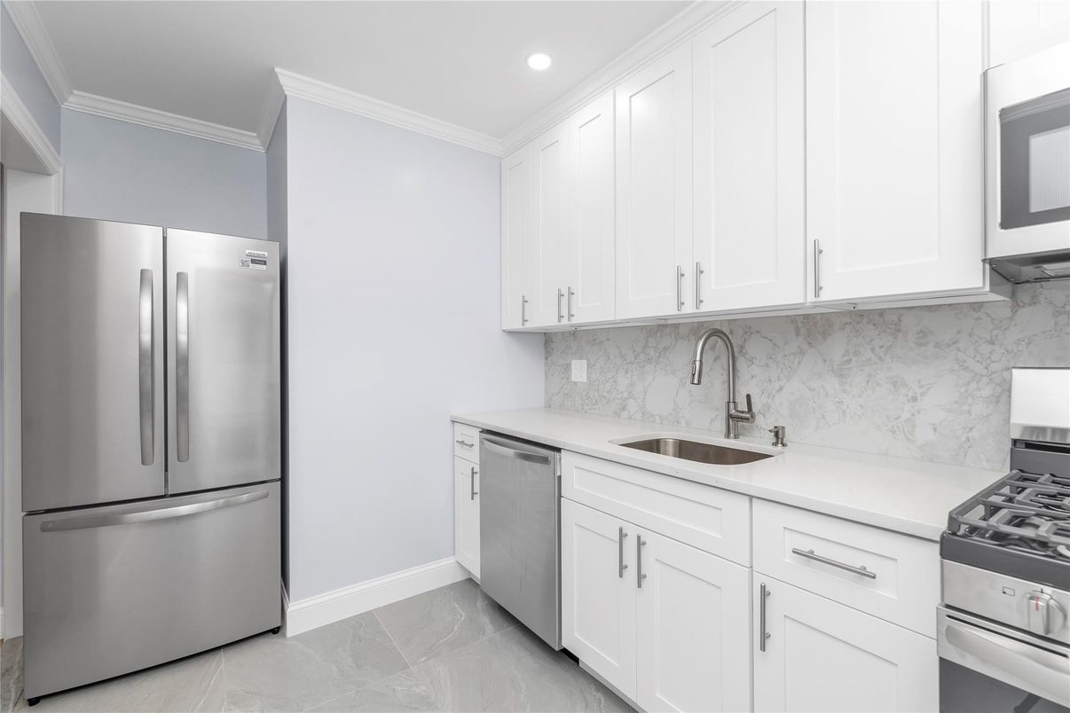 Interior, Kitchen, Marble Walls, Recessed Lighting, Stainless Steel Appliances