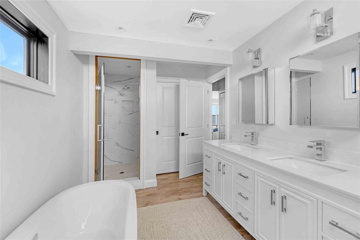 Bathroom, Dual Sink Vanities, Free Standing Baths, Interior, Marble Walls, Wood Texture Flooring