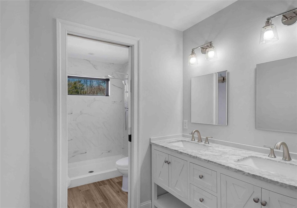 Bathroom, Dual Sink Vanities, Interior, Marble Walls, Wood Texture Flooring