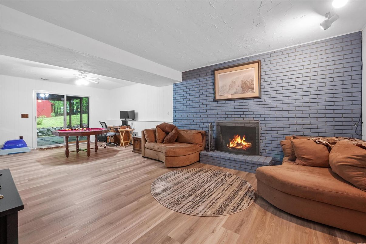 Fireplace, Game Room, Interior, Living room, Stone Walls, Wood Texture Flooring