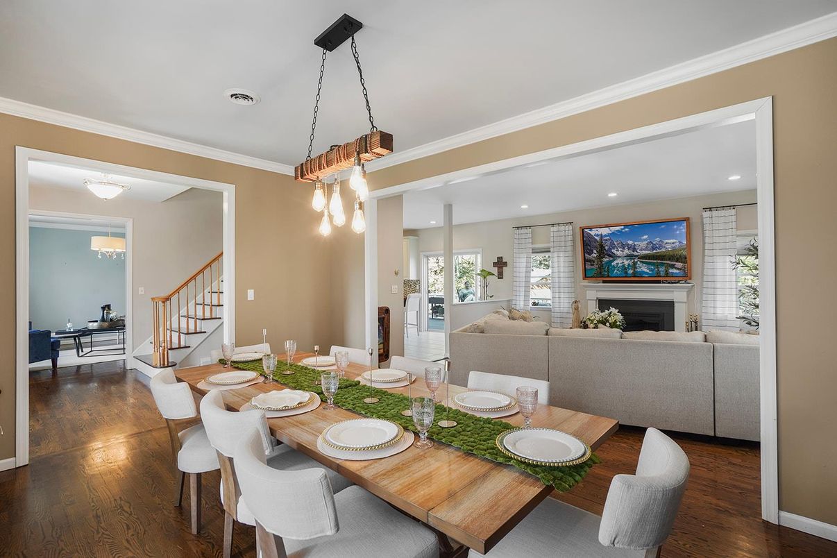 Dining room, Fireplace, Interior, Living room, Pendant Lights, Recessed Lighting, Wood Texture Flooring