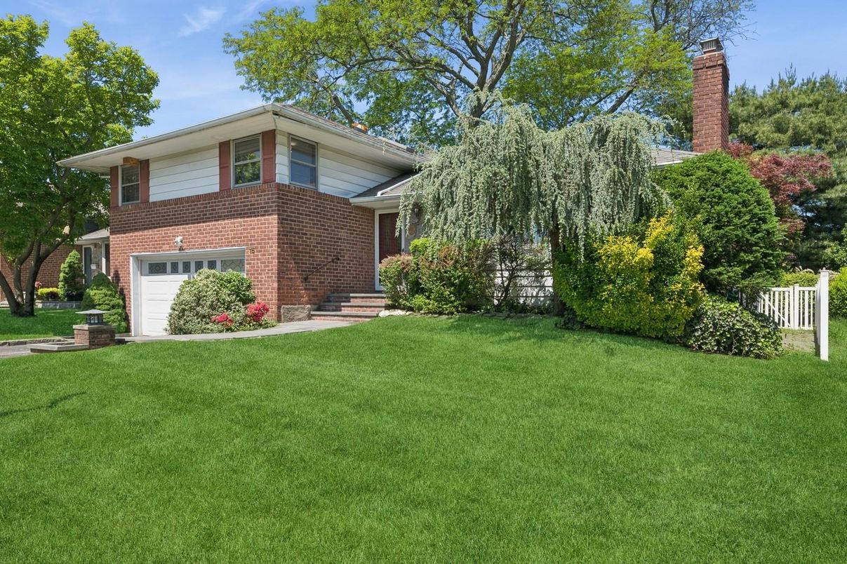 Attached, Backyard, Exterior, Facade, Brick Facade, Split Level