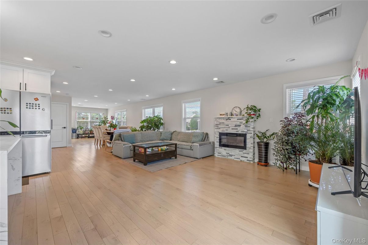 Dining room, Fireplace, Interior, Kitchen, Living room, Recessed Lighting, Wood Texture Flooring
