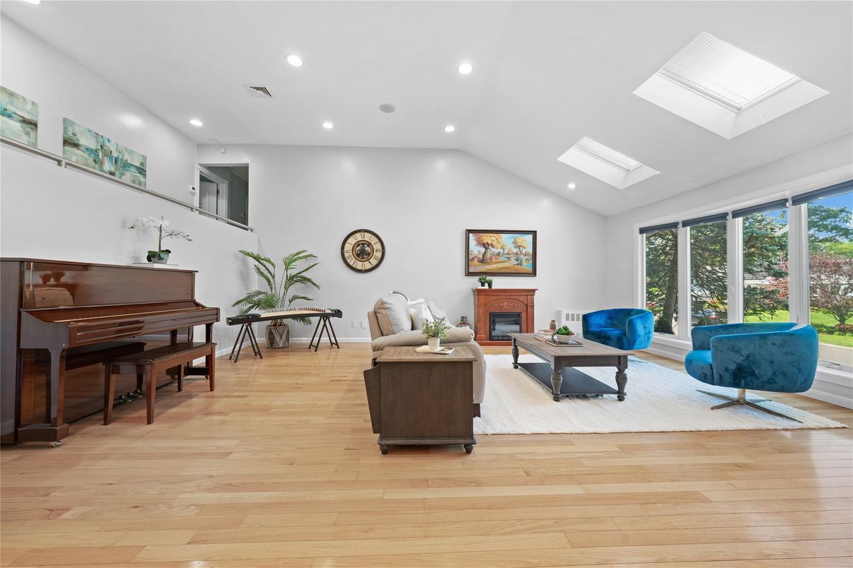 Fireplace, Interior, Living room, Piano, Recessed Lighting, Wood Texture Flooring