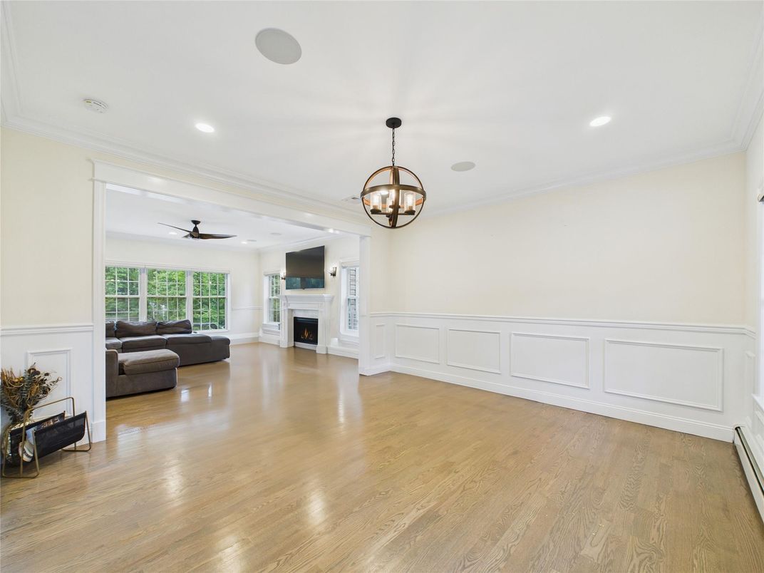 Chandelier, Fireplace, Interior, Living room, Recessed Lighting, Wood Texture Flooring