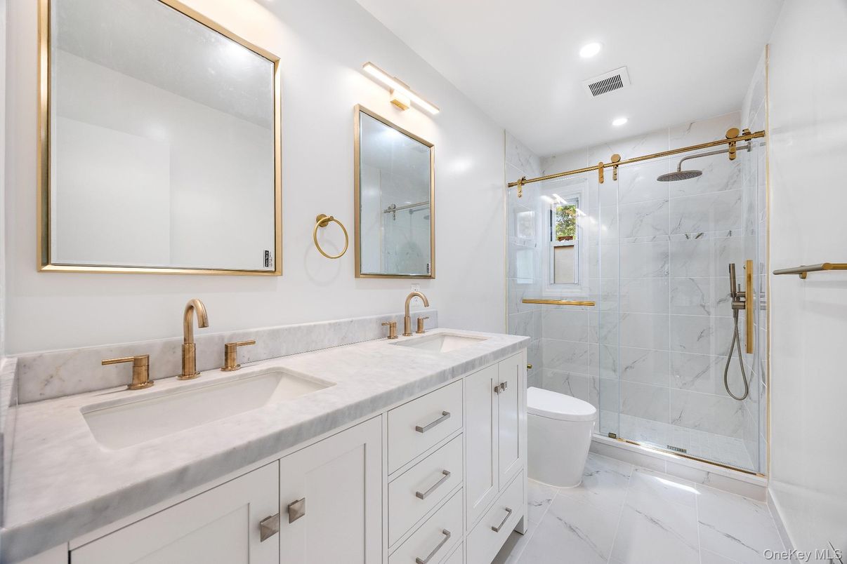 Bathroom, Dual Sink Vanities, Glass Shower, Interior, Marble, Marble Walls, Recessed Lighting