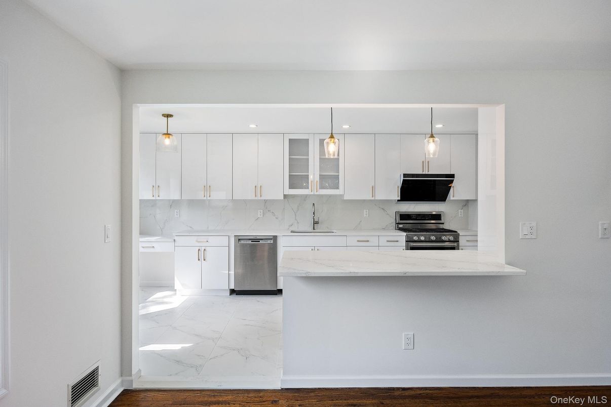 Interior, Kitchen, Marble, Marble Walls, Pendant Lights, Stainless Steel Appliances, Wood Texture Flooring
