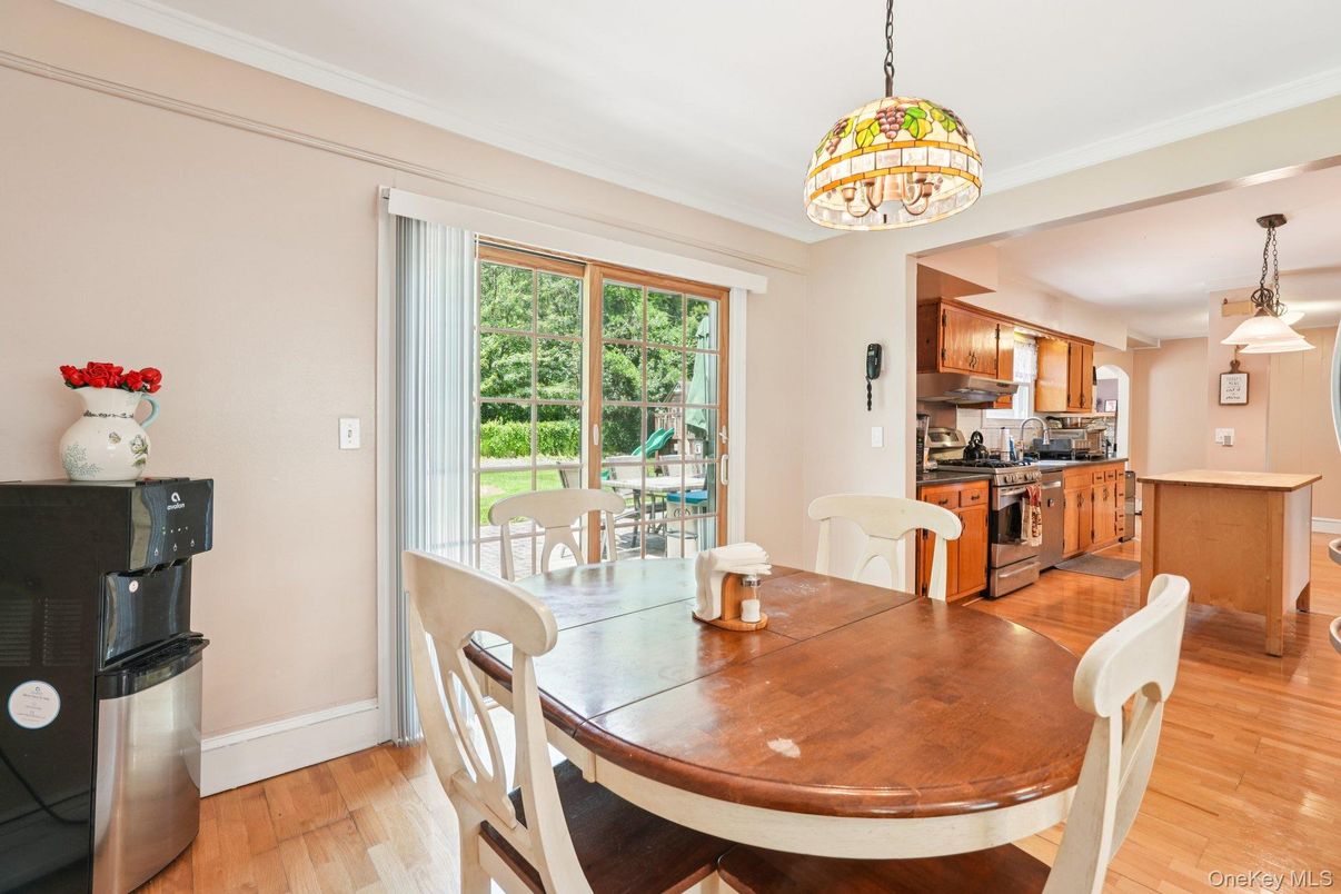 Chandelier, Dining room, Interior, Kitchen, Pendant Lights, Stainless Steel Appliances, Wood Texture Flooring