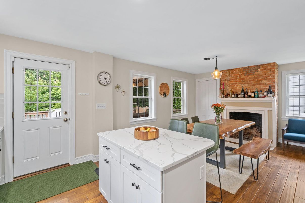 Dining room, Fireplace, Interior, Pendant Lights, Stone Walls, Wood Texture Flooring