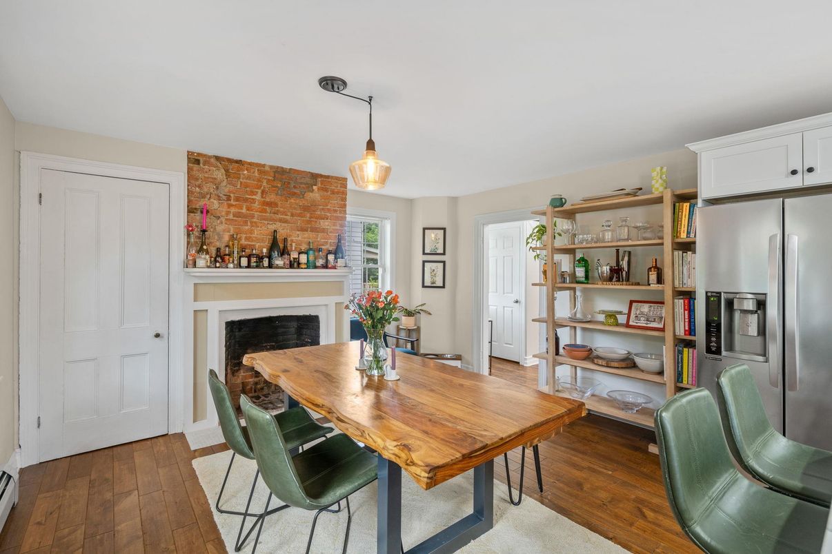 Dining room, Fireplace, Interior, Kitchen, Pendant Lights, Stainless Steel Appliances, Stone Walls, Wood Texture Flooring