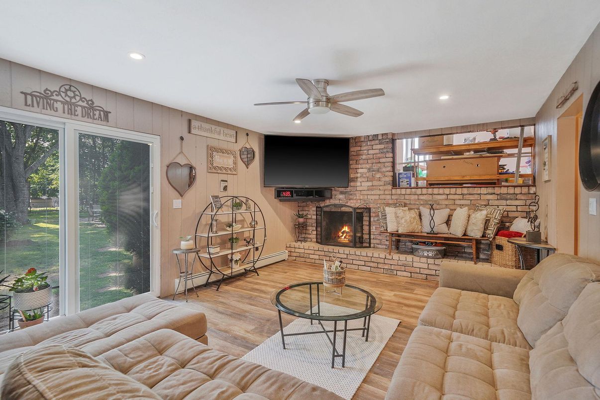 Fireplace, Interior, Living room, Recessed Lighting, Stone Walls, Wood Texture Flooring