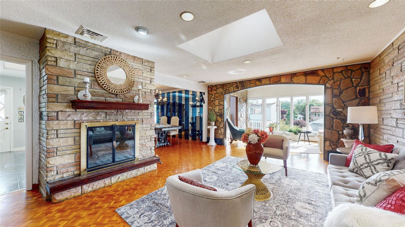 Fireplace, Interior, Living room, Recessed Lighting, Stone Walls, Wood Texture Flooring