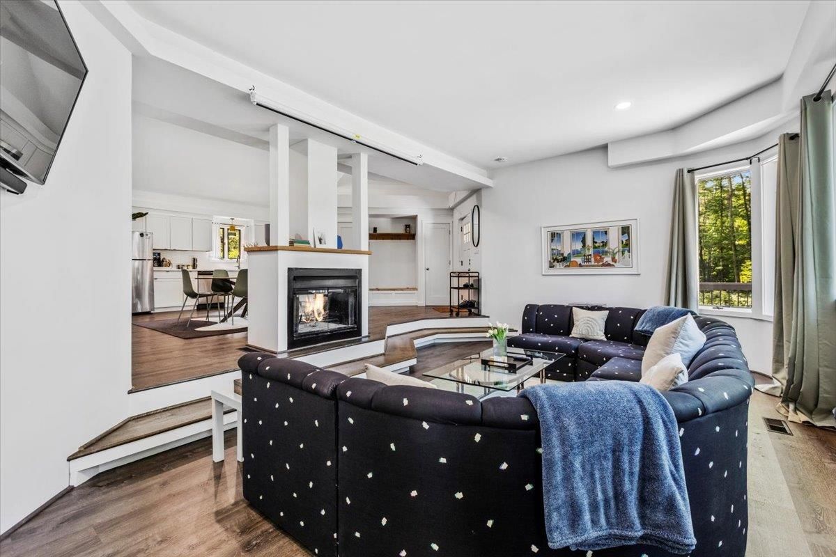 Dining room, Fireplace, Interior, Living room, Recessed Lighting, Wood Texture Flooring