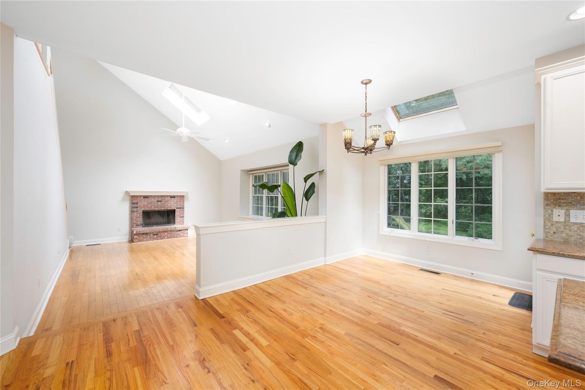 Chandelier, Empty room, Fireplace, Interior, Recessed Lighting, Wood Texture Flooring