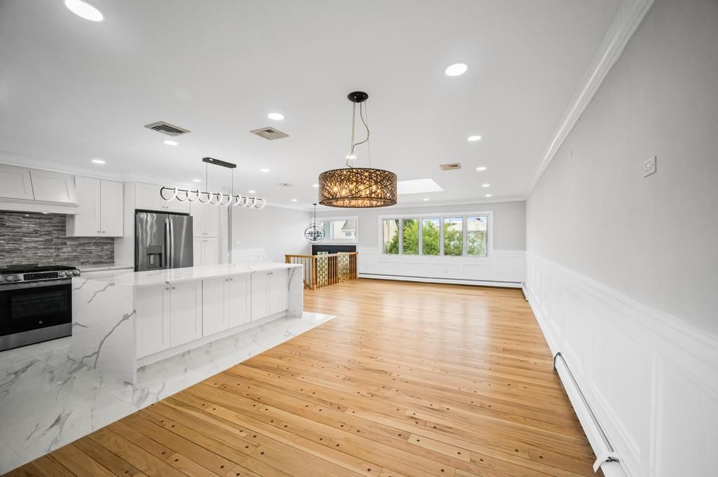 Interior, Kitchen, Marble, Pendant Lights, Recessed Lighting, Stainless Steel Appliances, Wood Texture Flooring