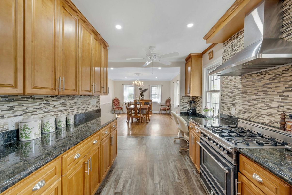 Chandelier, Dining room, Interior, Kitchen, Recessed Lighting, Stainless Steel Appliances, Wood Texture Flooring