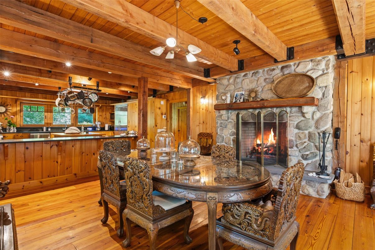 Chandelier, Dining room, Fireplace, Interior, Recessed Lighting, Stone Walls, Wooden Beams, Wooden Ceilings, Wood Texture Flooring, Wooden Walls