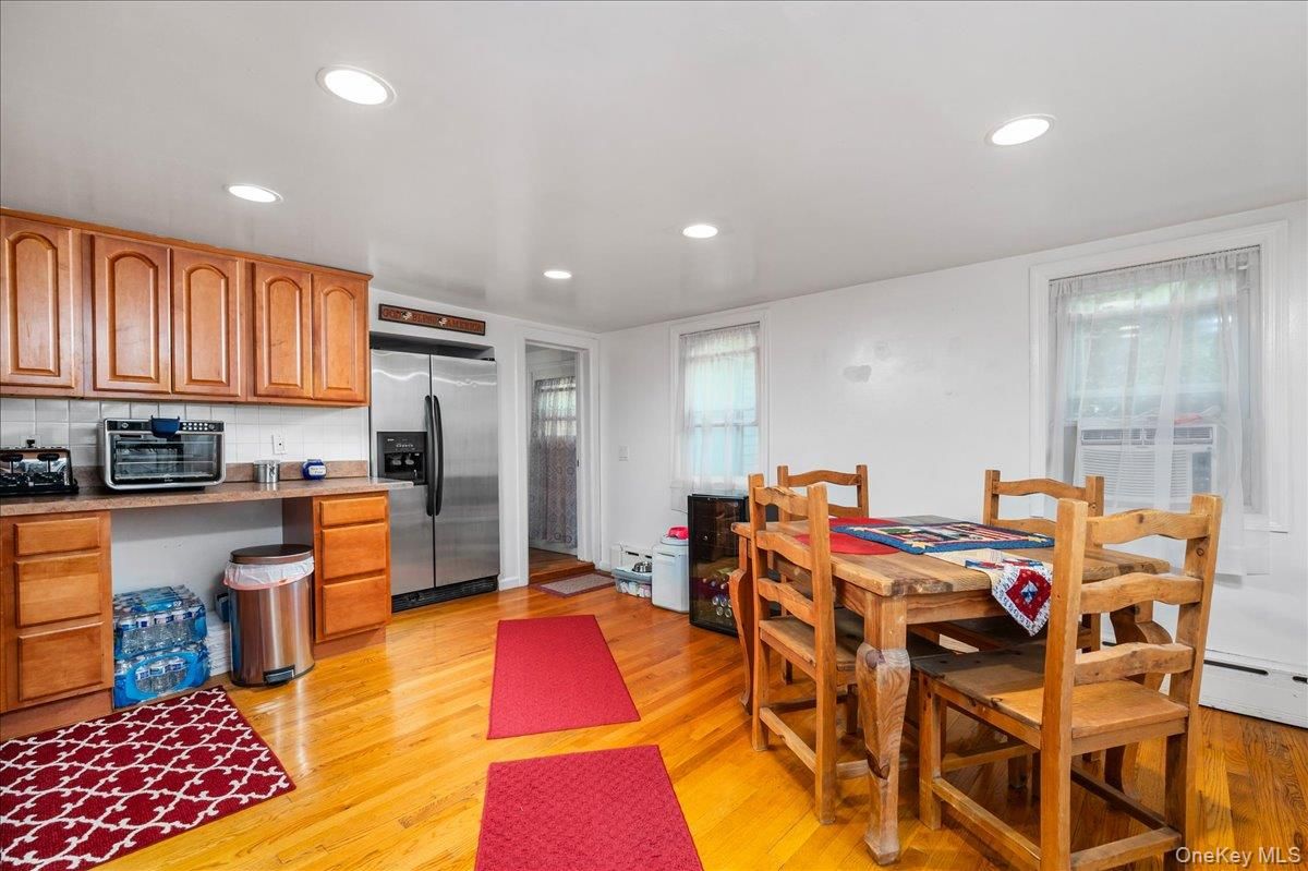 Dining room, Interior, Kitchen, Recessed Lighting, Stainless Steel Appliances, Wood Texture Flooring