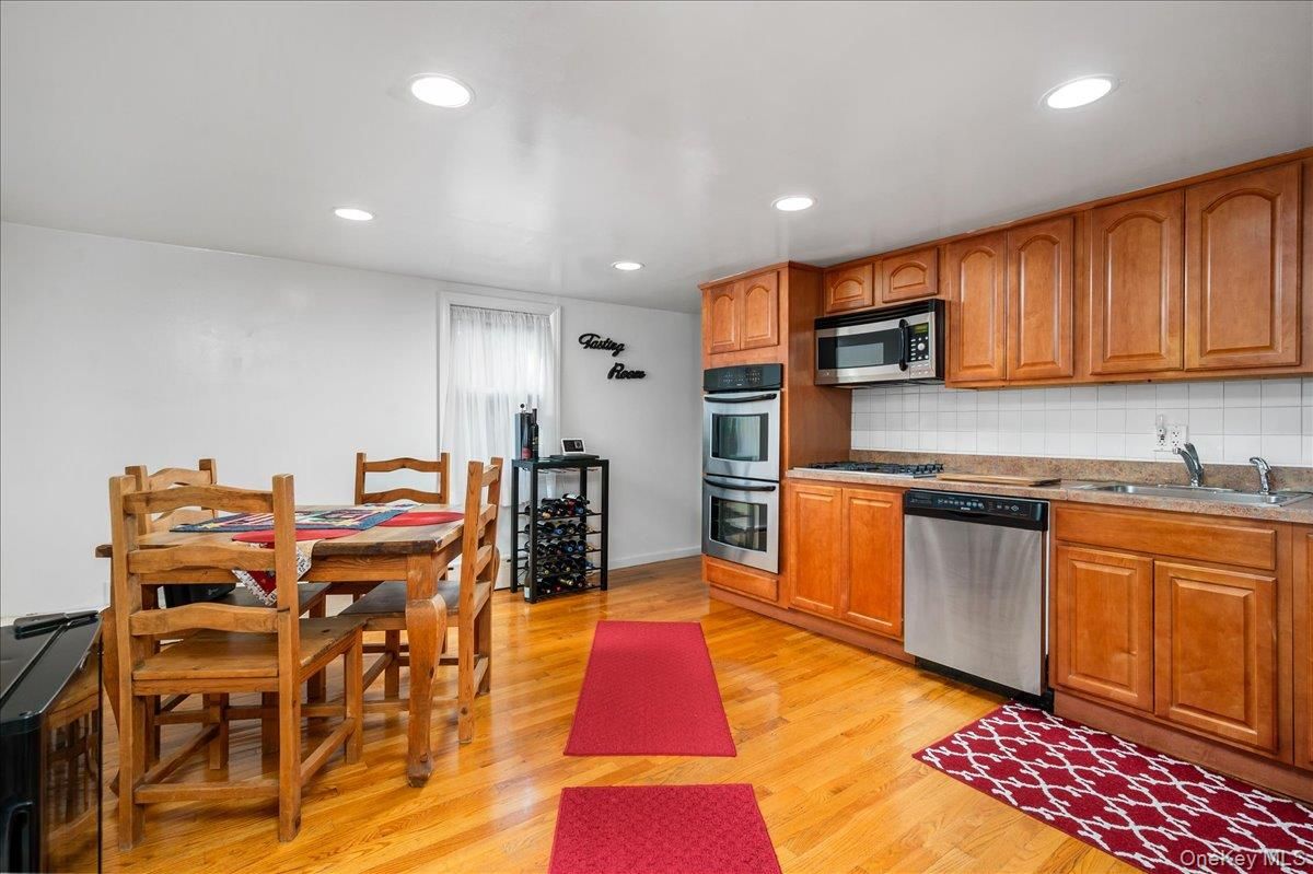 Dining room, Interior, Kitchen, Recessed Lighting, Stainless Steel Appliances, Wood Texture Flooring