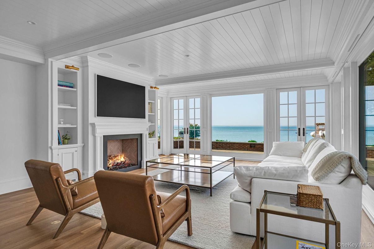 Fireplace, Interior, Living room, Recessed Lighting, Water, Wood Texture Flooring