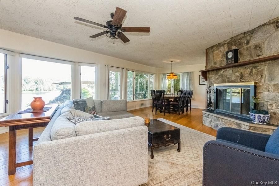 Dining room, Fireplace, Interior, Living room, Pendant Lights, Stone Walls, Wood Texture Flooring