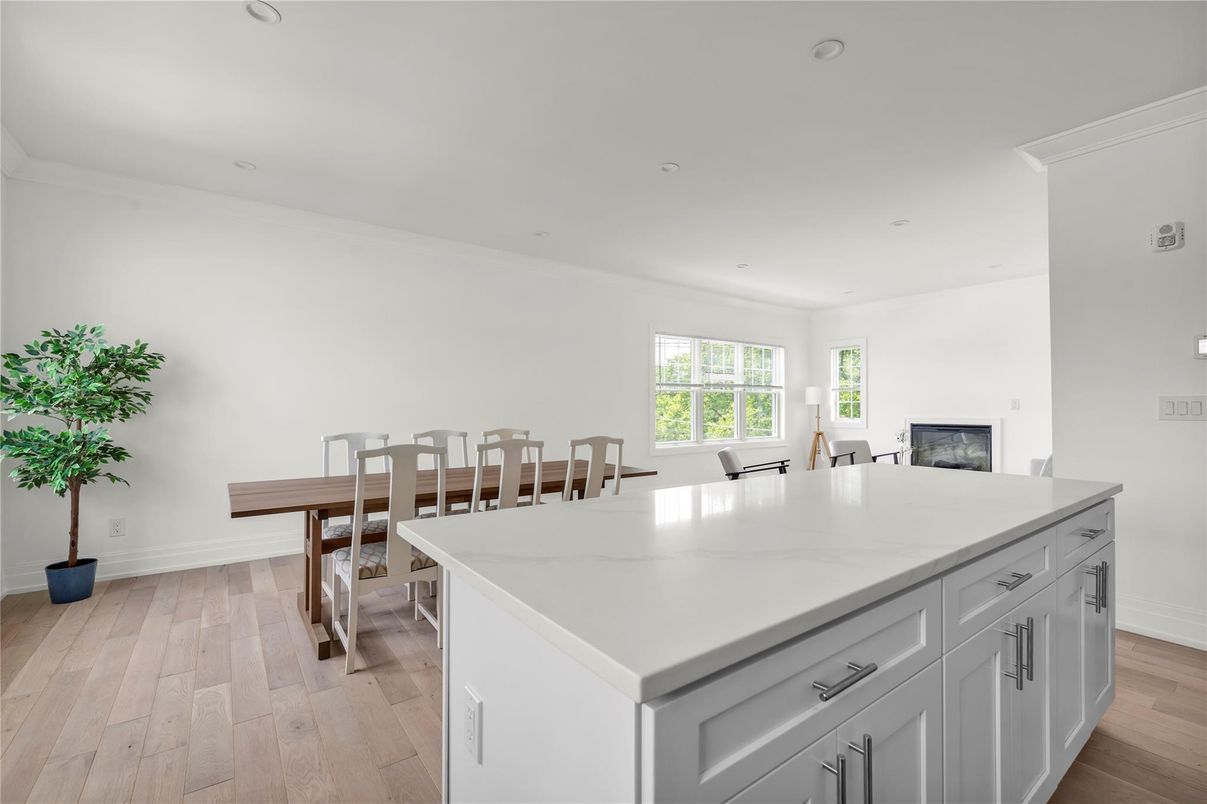 Dining room, Fireplace, Interior, Kitchen, Recessed Lighting, Wood Texture Flooring