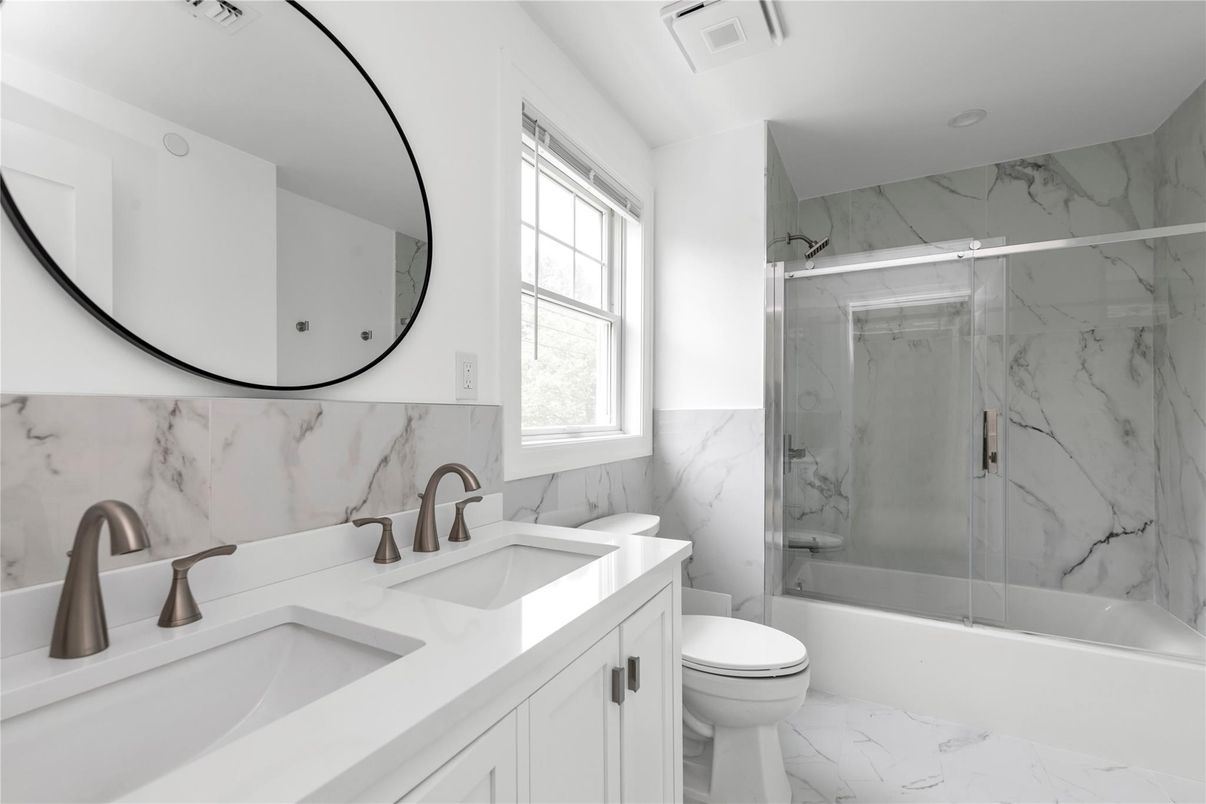 Bathroom, Dual Sink Vanities, Glass Shower, Interior, Marble, Marble Walls, Recessed Lighting