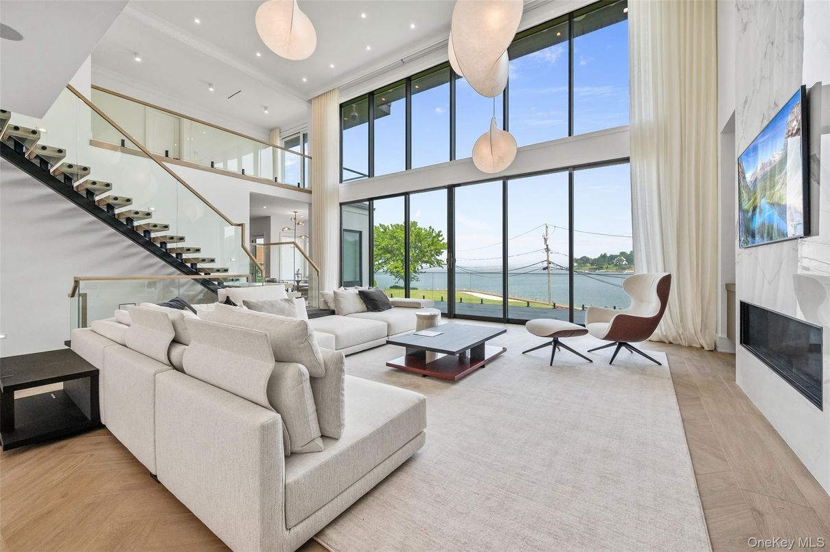 Fireplace, Interior, Living room, Pendant Lights, Recessed Lighting, Water, Wood Texture Flooring