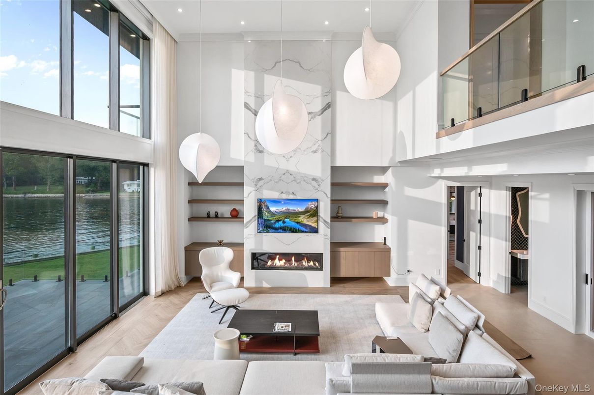 Fireplace, Interior, Living room, Marble Walls, Pendant Lights, Recessed Lighting, Water, Wood Texture Flooring