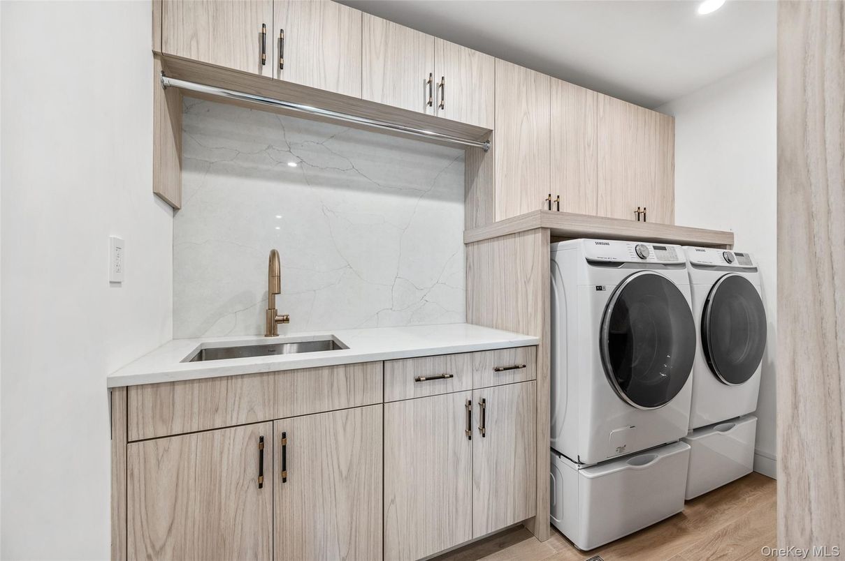 Interior, Marble Walls, Recessed Lighting, Washer, Wood Texture Flooring