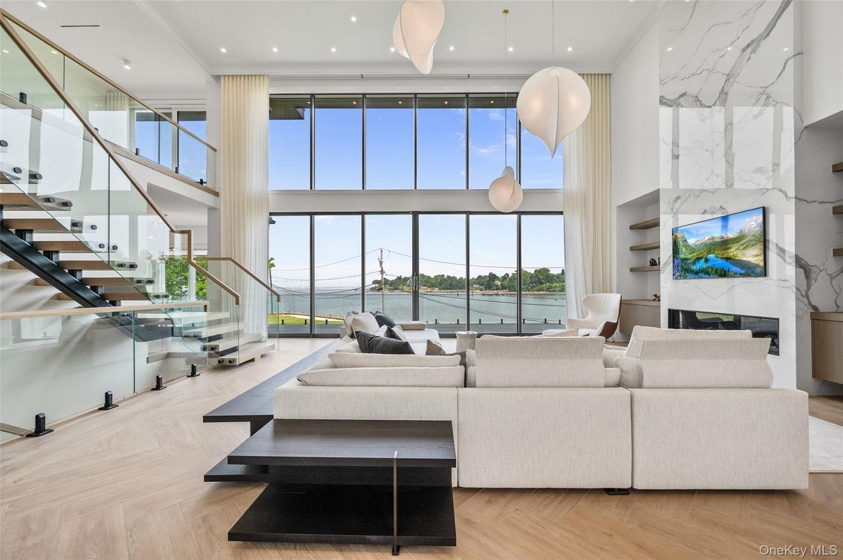 Fireplace, Interior, Living room, Marble Walls, Pendant Lights, Recessed Lighting, Water, Wood Texture Flooring