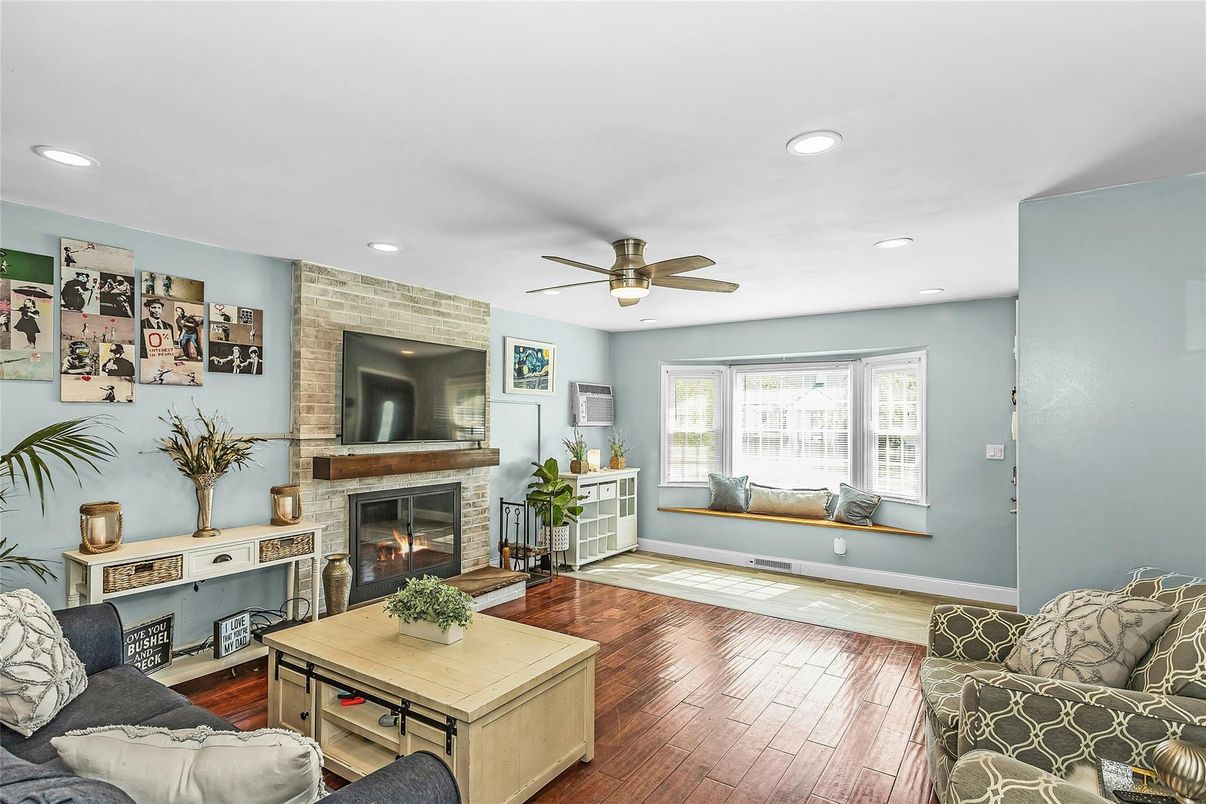 Fireplace, Interior, Living room, Recessed Lighting, Stone Walls, Wood Texture Flooring