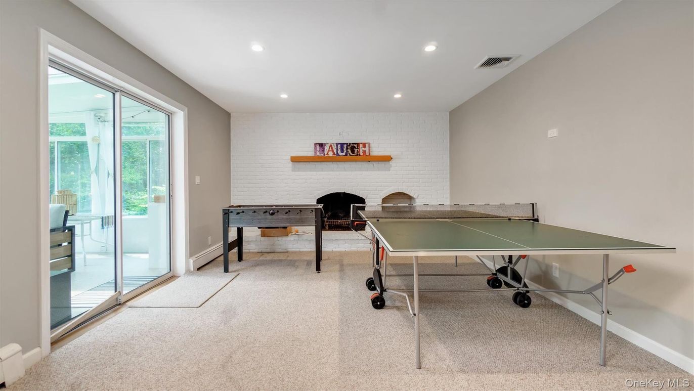 Fireplace, Game Room, Interior, Recessed Lighting, Stone Walls