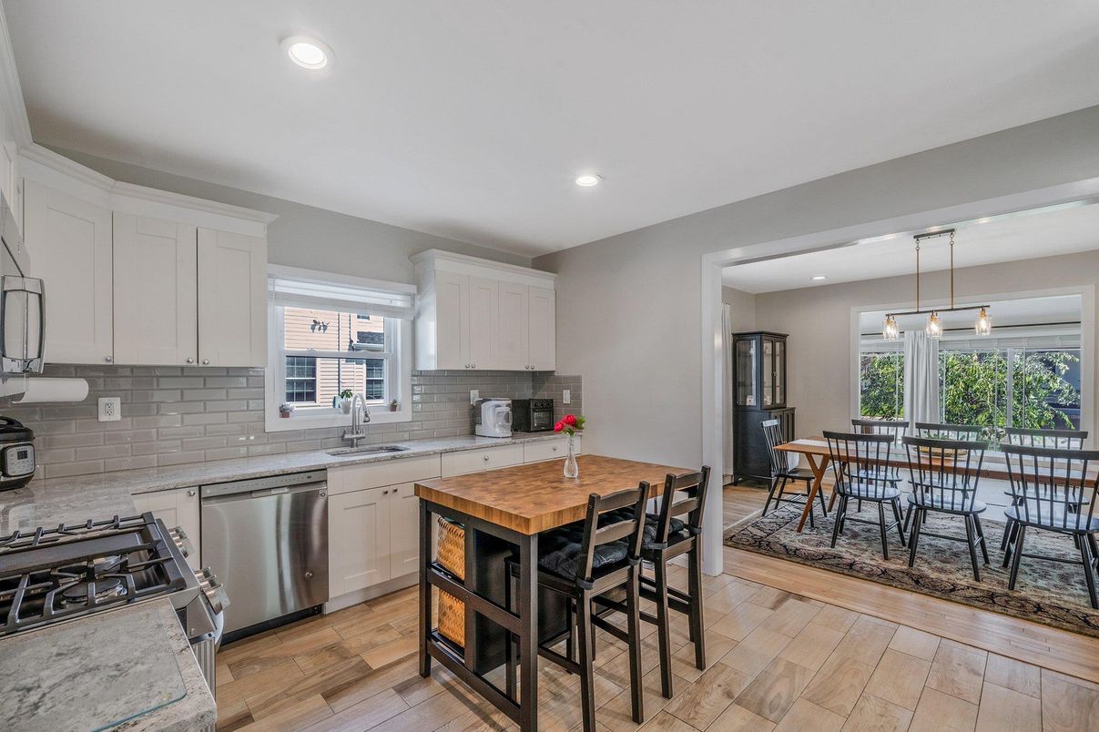 Dining room, Interior, Kitchen, Pendant Lights, Recessed Lighting, Stainless Steel Appliances, Wood Texture Flooring
