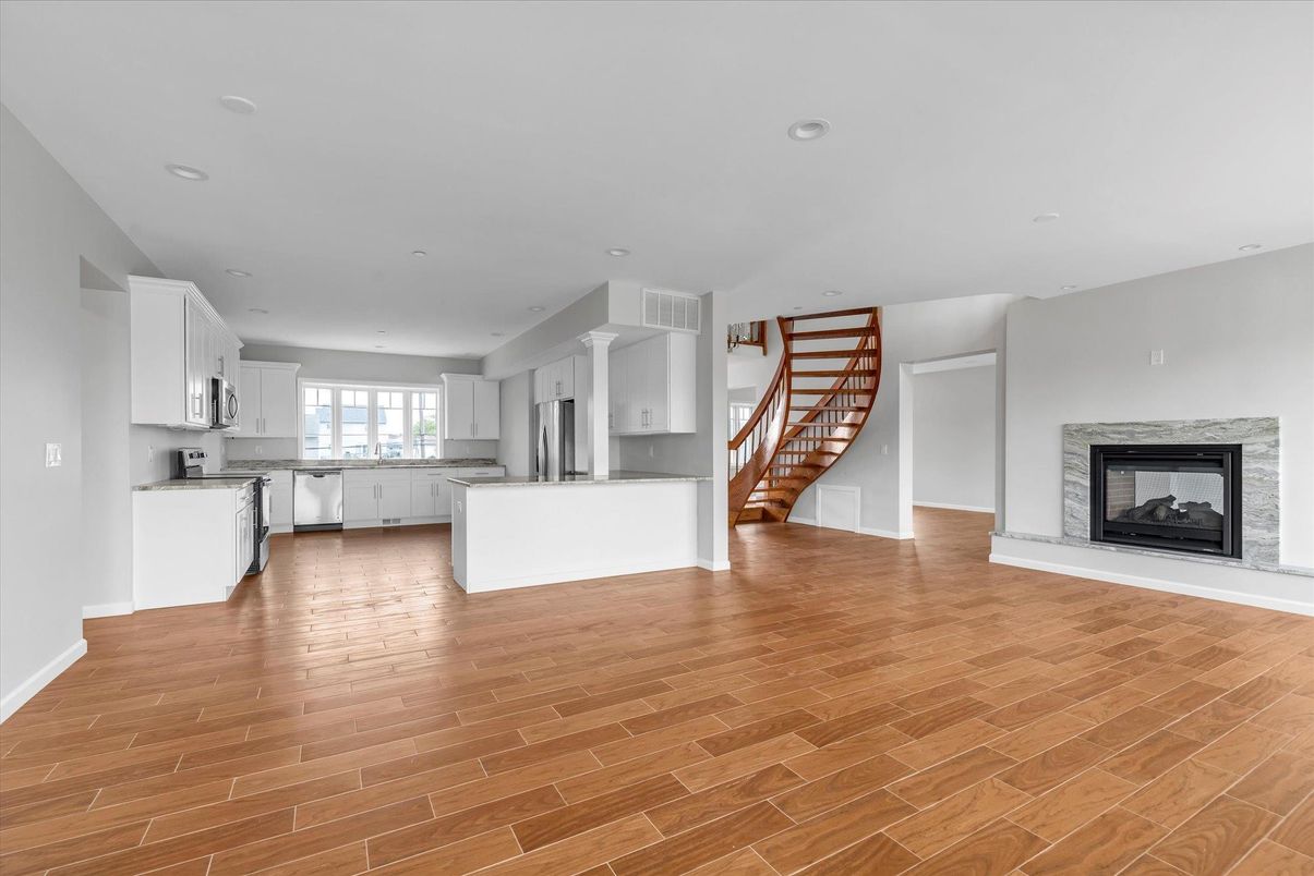 Empty room, Fireplace, Interior, Kitchen, Recessed Lighting, Wood Texture Flooring