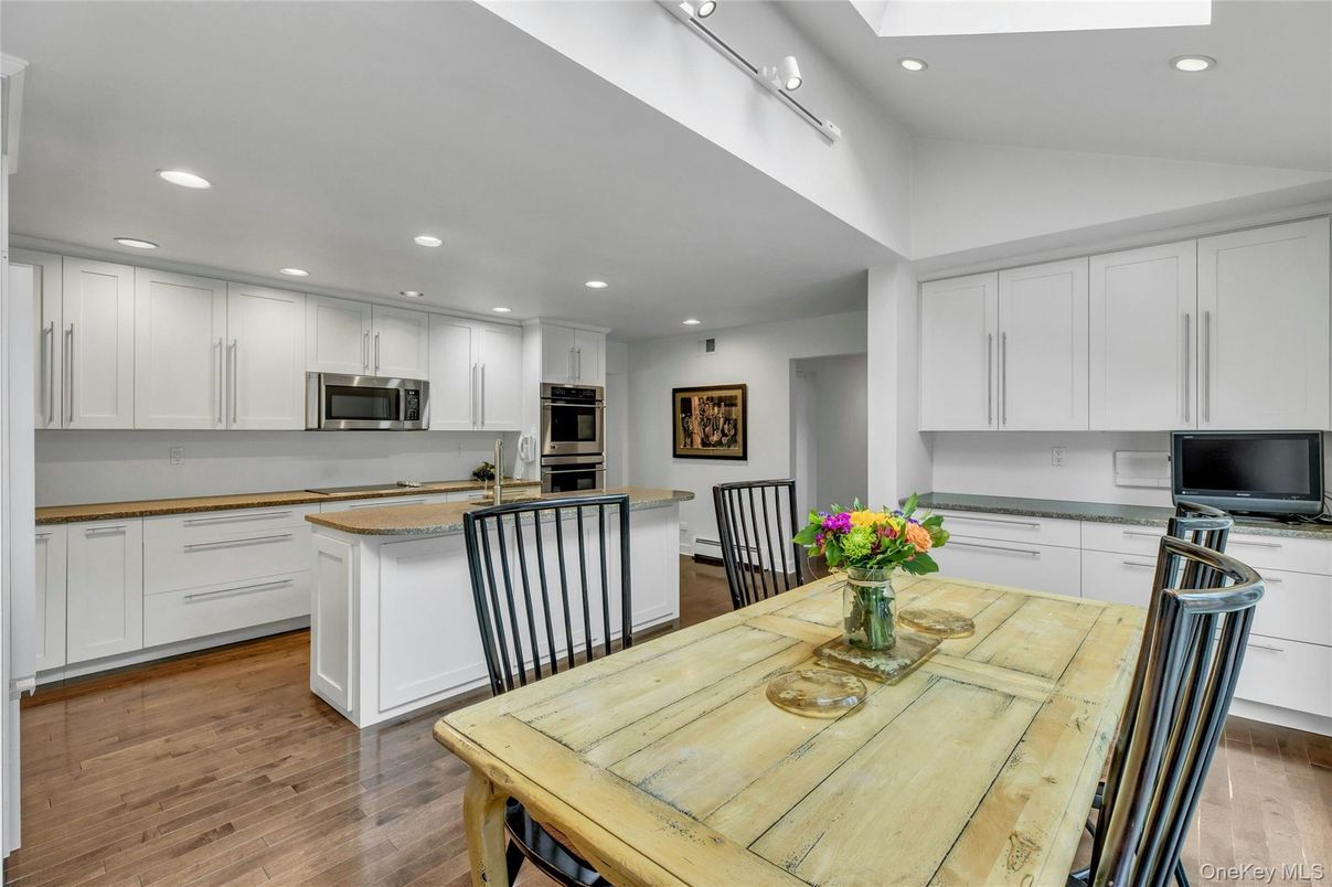 Dining room, Interior, Kitchen, Recessed Lighting, Stainless Steel Appliances, Wood Texture Flooring