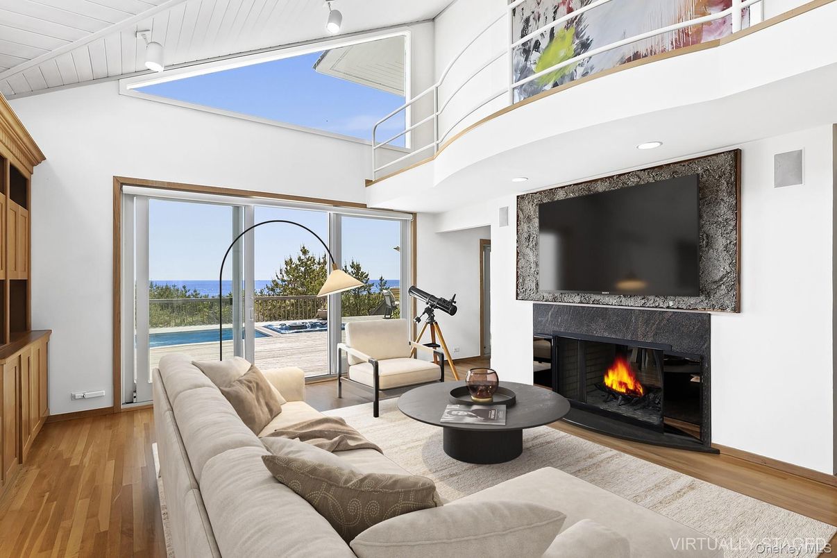 Fireplace, Interior, Living room, Recessed Lighting, Water, Wood Texture Flooring