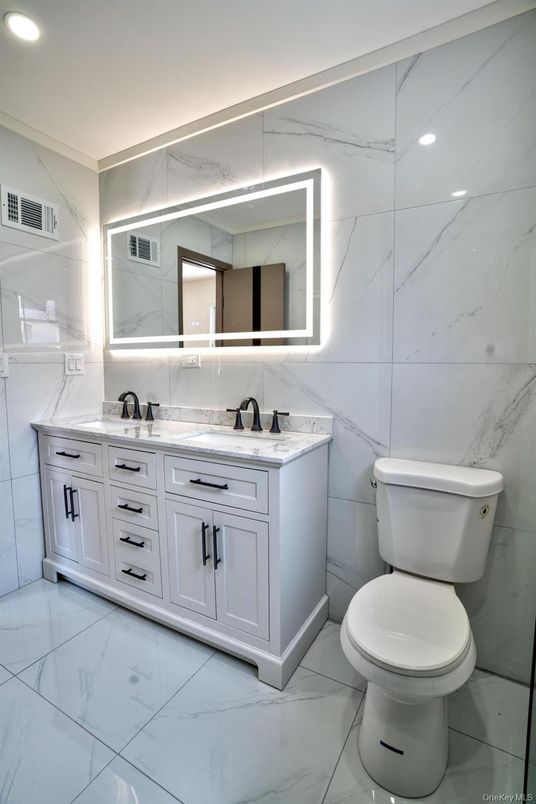 Bathroom, Dual Sink Vanities, Interior, Marble, Marble Walls, Recessed Lighting