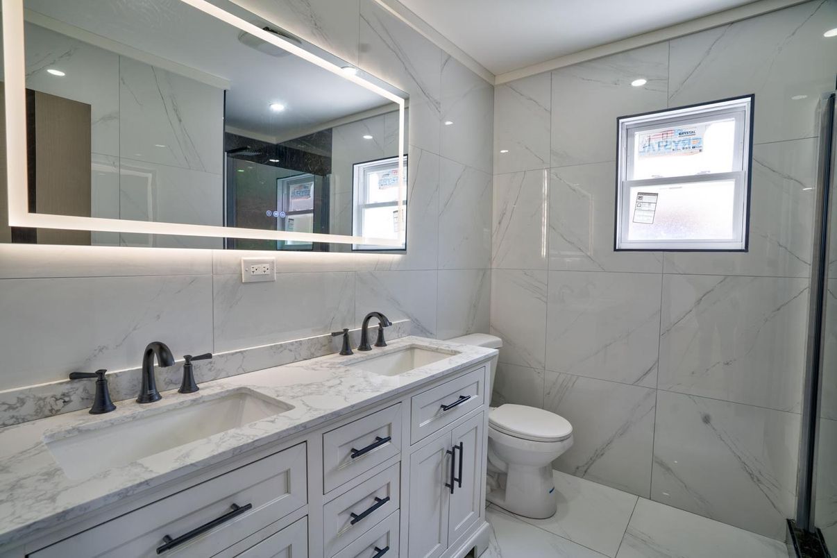 Bathroom, Dual Sink Vanities, Interior, Marble, Marble Walls, Recessed Lighting