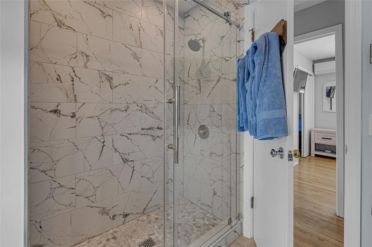 Bathroom, Glass Shower, Interior, Marble Walls, Wood Texture Flooring