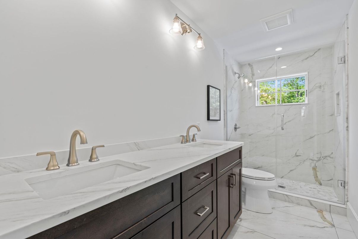 Bathroom, Dual Sink Vanities, Glass Shower, Interior, Marble, Marble Walls, Recessed Lighting
