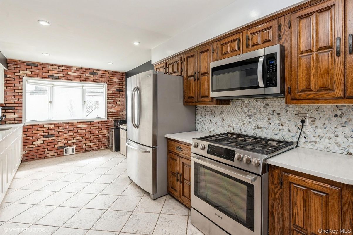 Interior, Kitchen, Recessed Lighting, Stainless Steel Appliances, Stone Walls, Washer